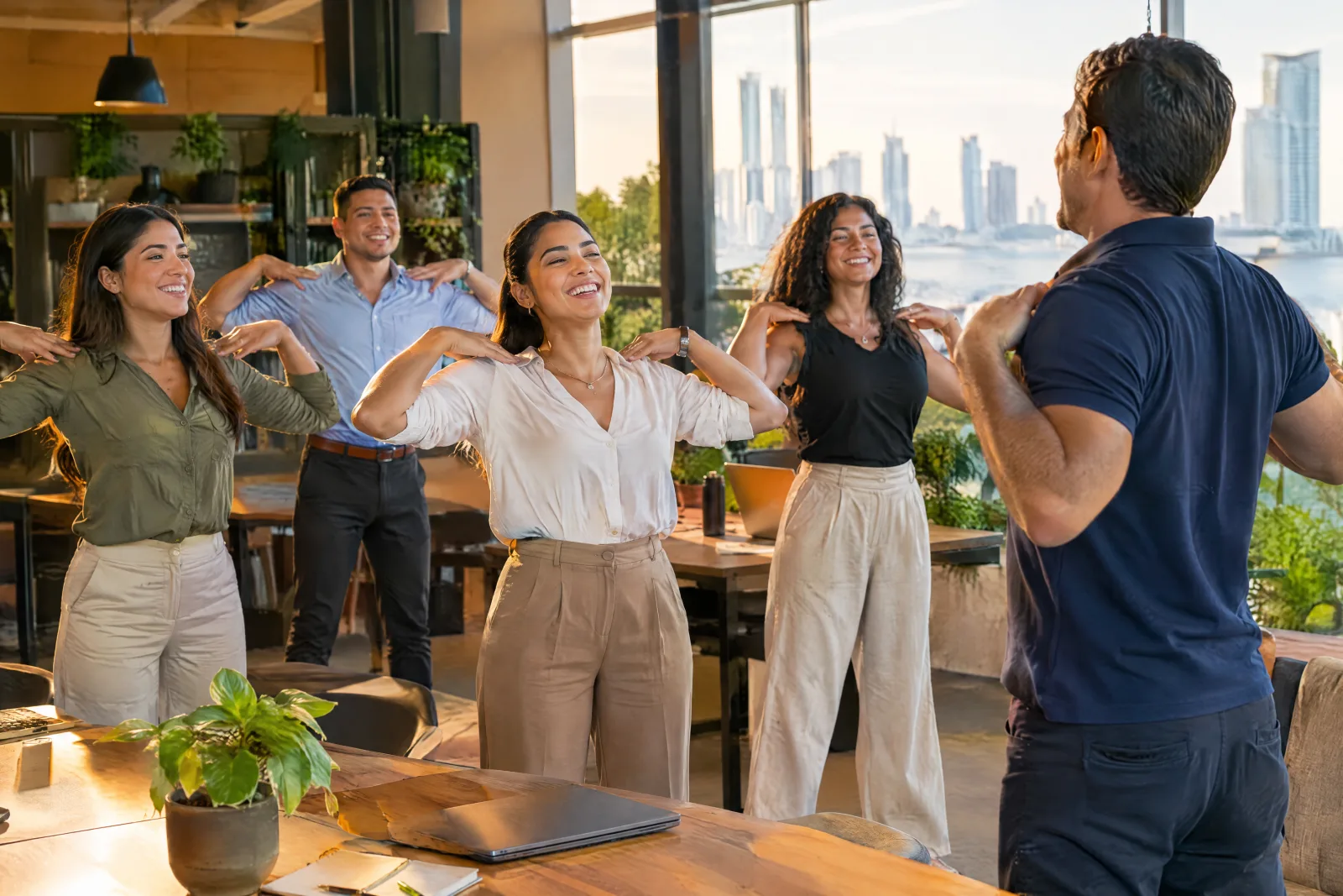 Employees smiling during an active break in a warm office