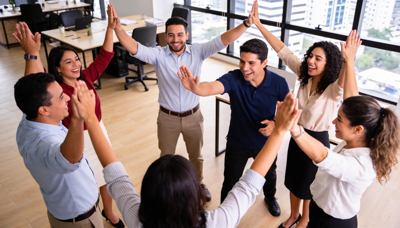 Office team laughing during an activity led by THA